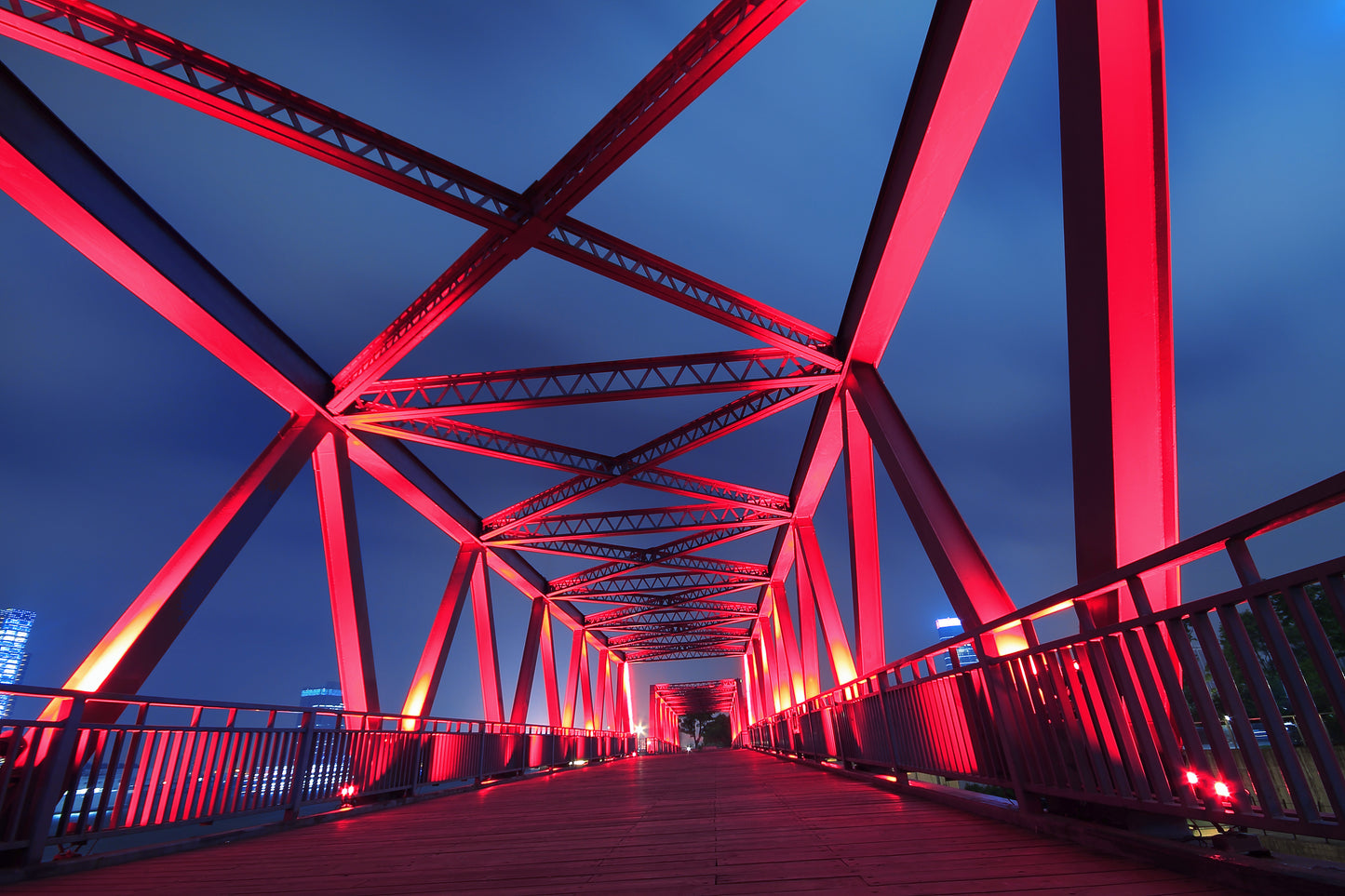 A metal bridge structure and railings painted in red Teknos Ferrex combi anti-corrosive metal paint.