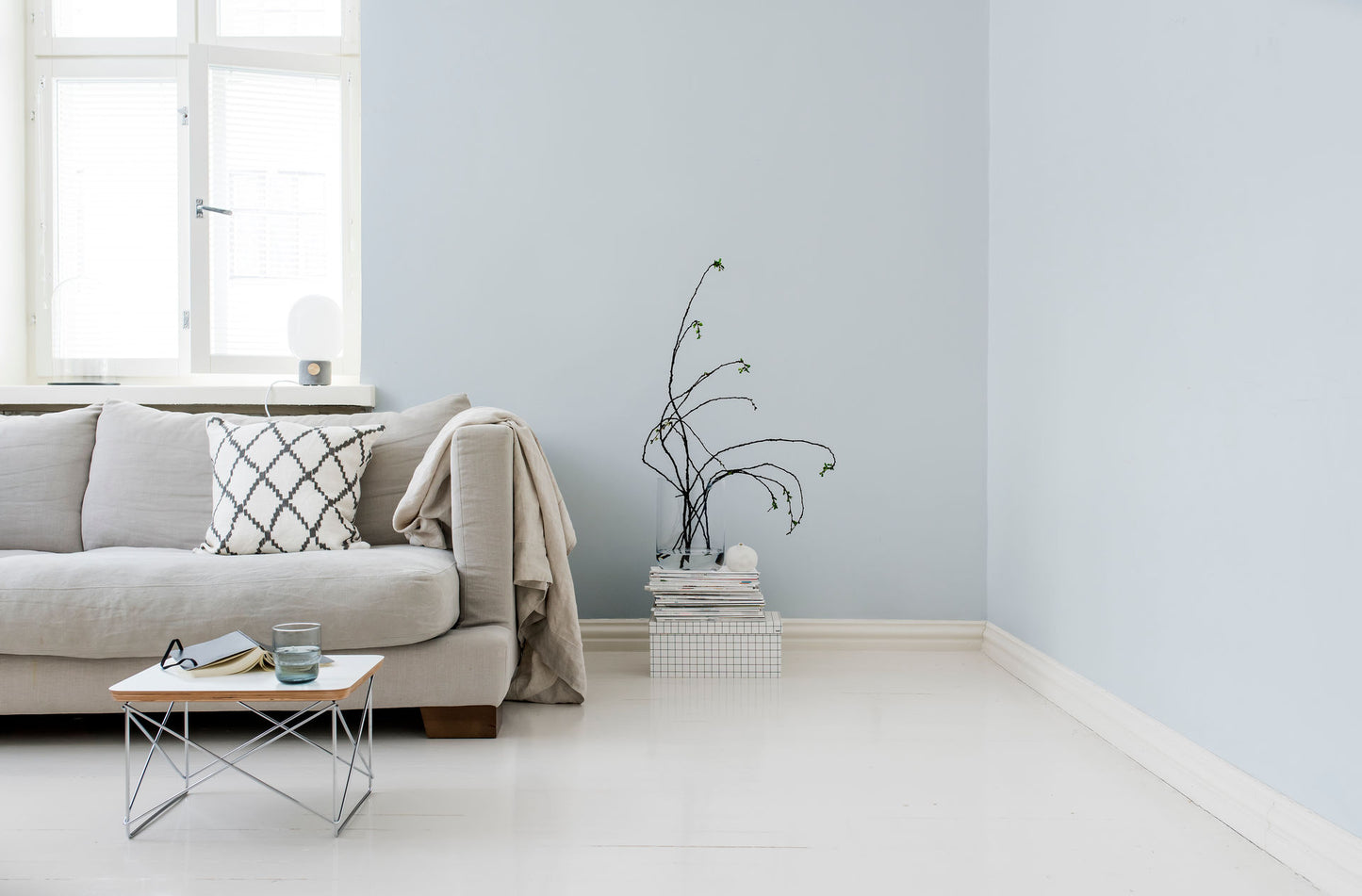 Living room walls painted in light blue Teknos Pro 5 matt emulsion